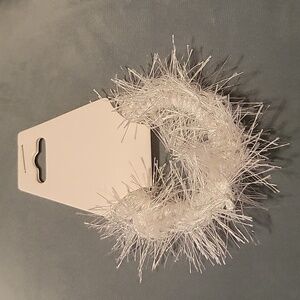 Hair tie made with white eyelash yarn.  Scrunchie  Nwt.